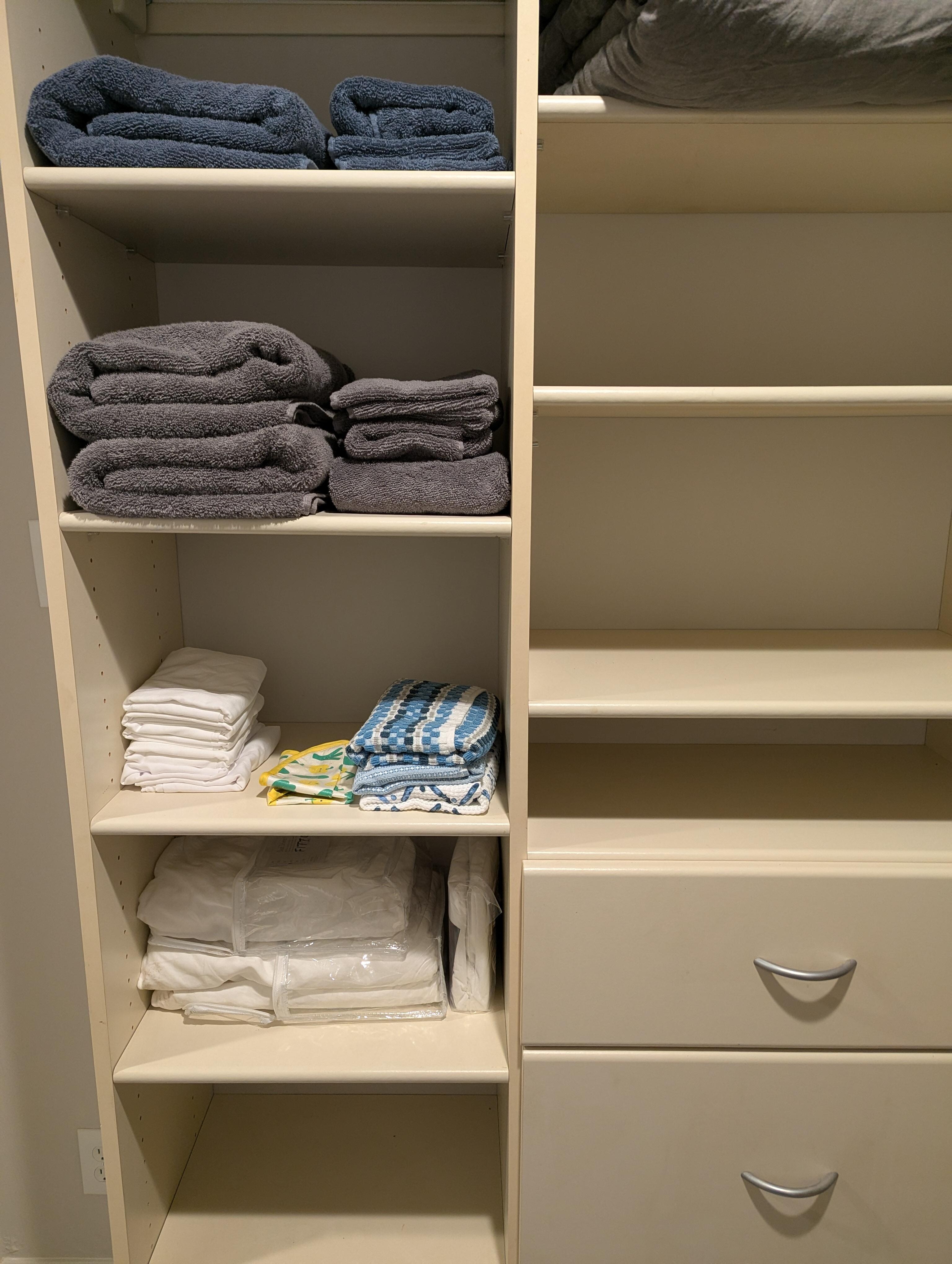 Walk in closet had plenty of storage, and nice touches like luggage racks and extra towels.