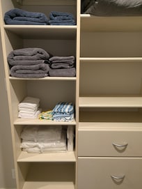 Walk in closet had plenty of storage, and nice touches like luggage racks and extra towels.