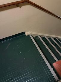 Stairwell with hair and dust everywhere
