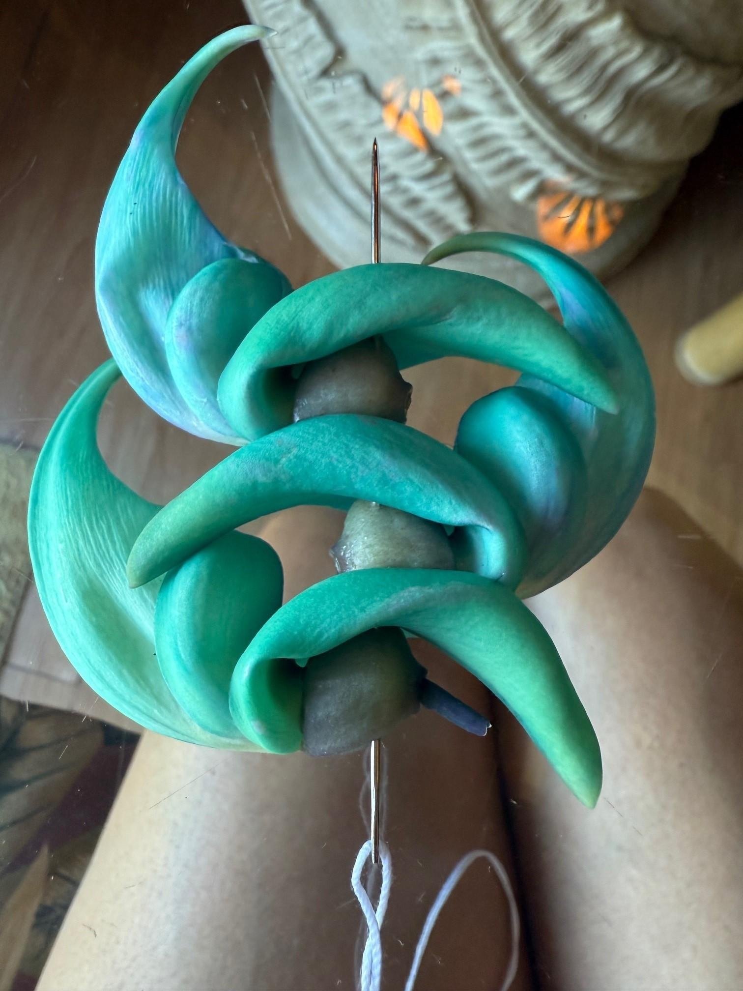 Auntie Miley taught me how to make a Leis using Blue Jade flowers