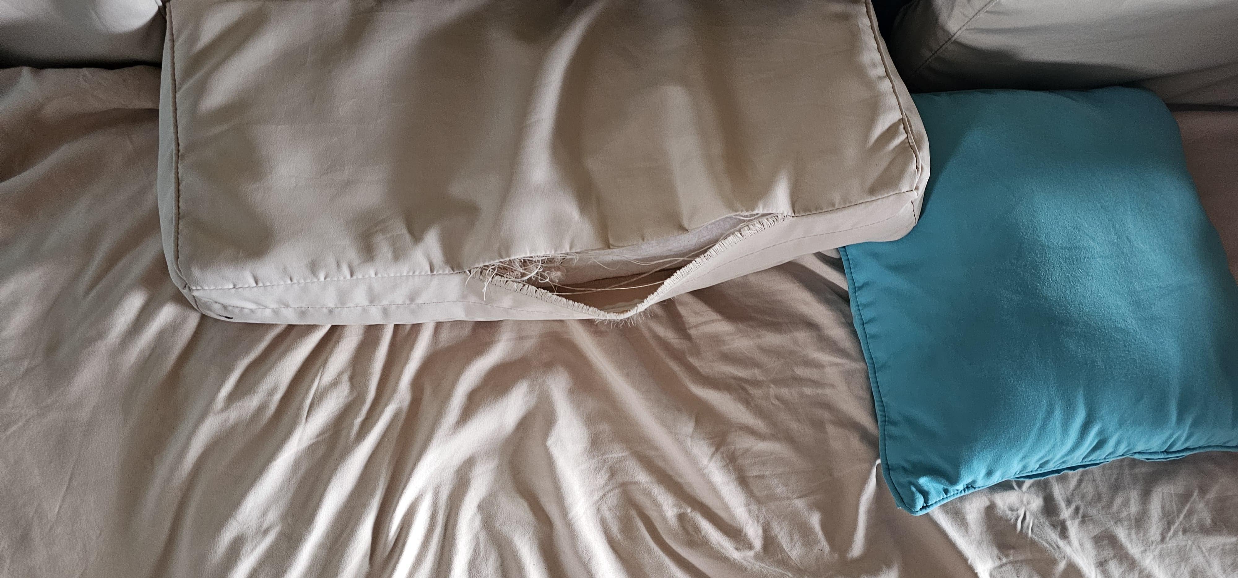 Torn cushions covered with a sheet