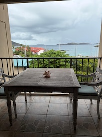 Balcony with very large table. Could use a clothes drying rack for wet towels and swimsuits.