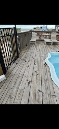 Hole by pool close to gate