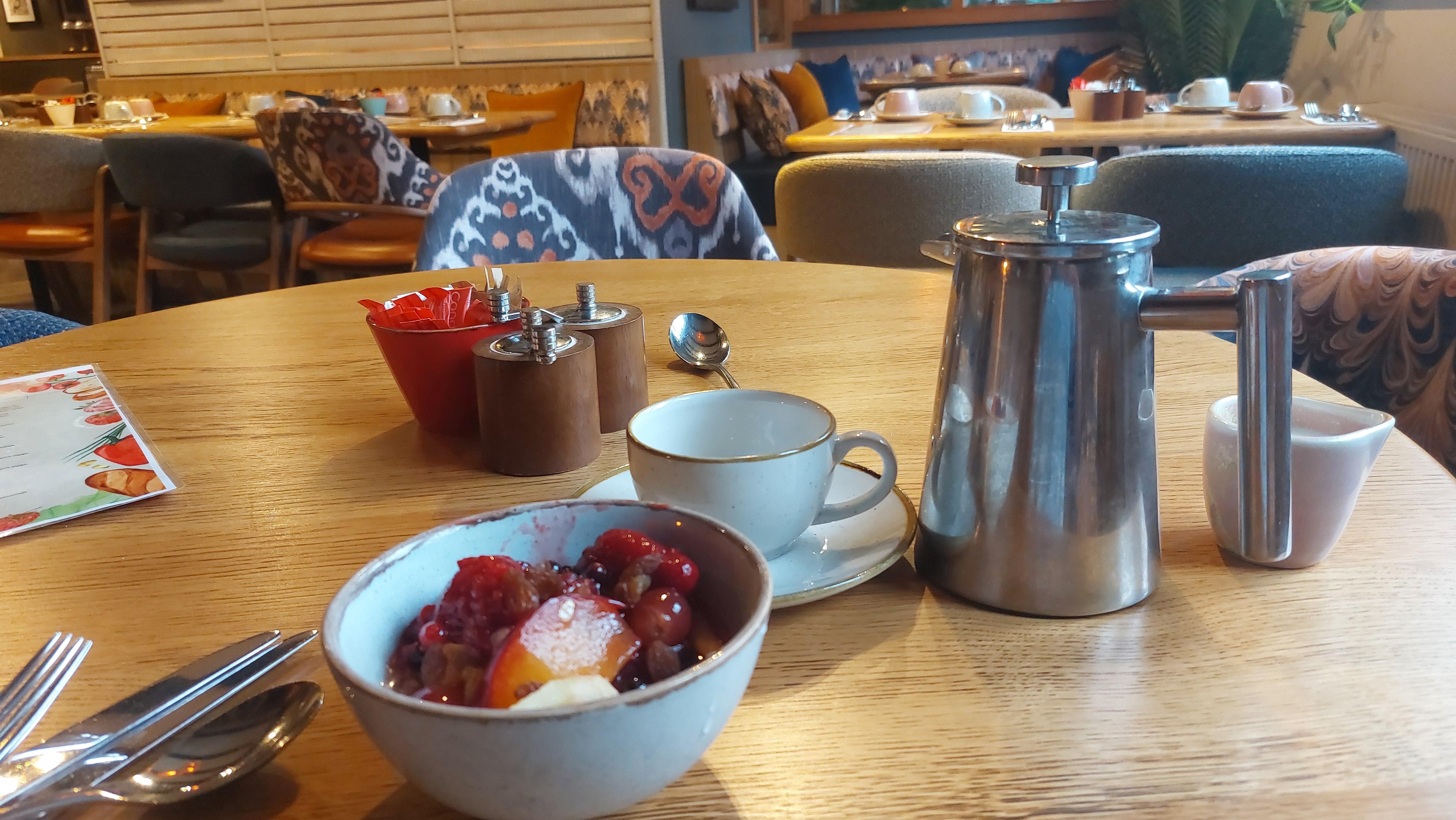 Fresh fruit and a pot of coffee