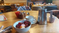 Fresh fruit and a pot of coffee