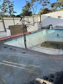 Stagnant water and debris in the "pool".