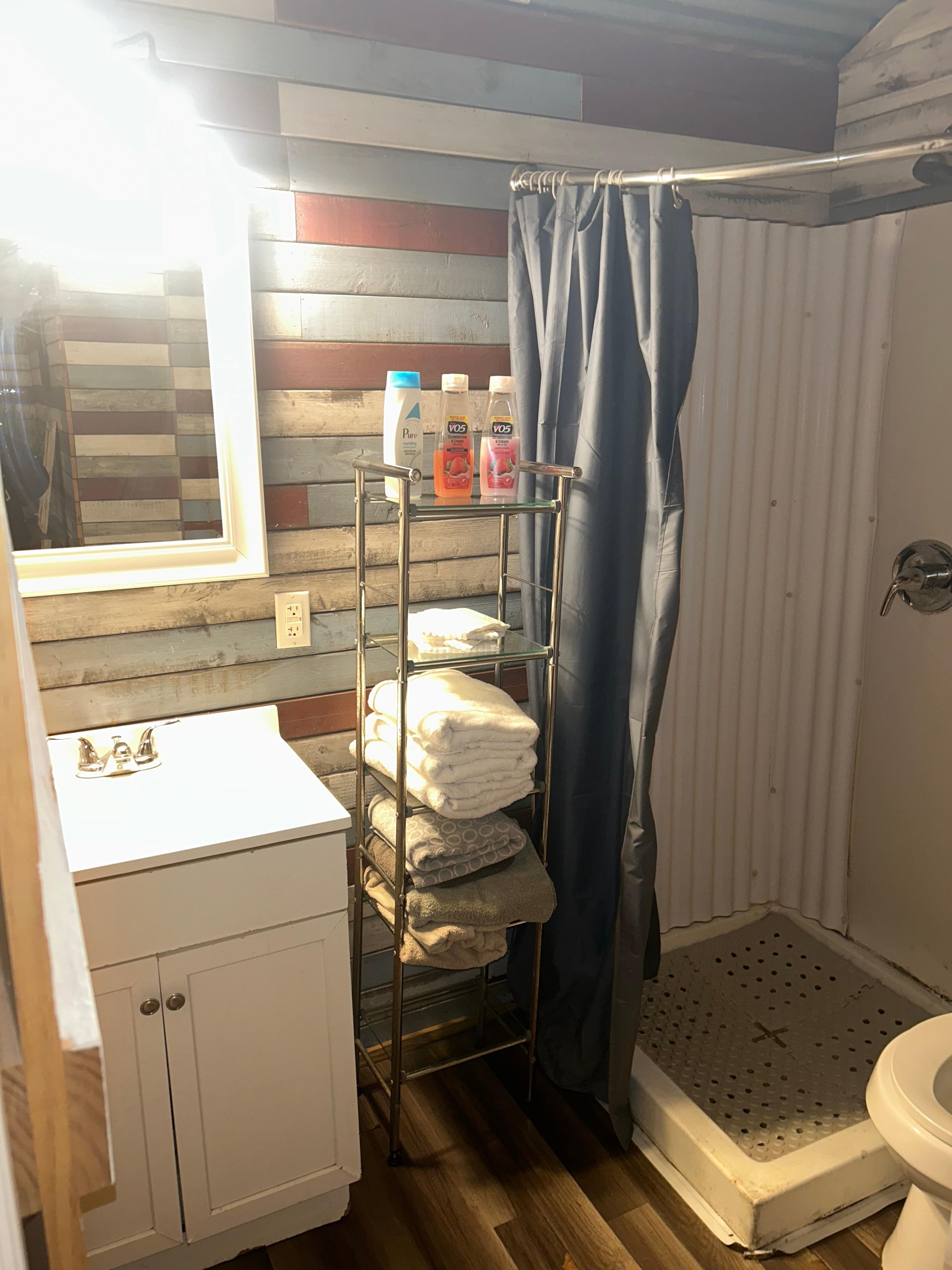 Bathroom, just zoom in you can see how cracked and the mold on the sides shower. 