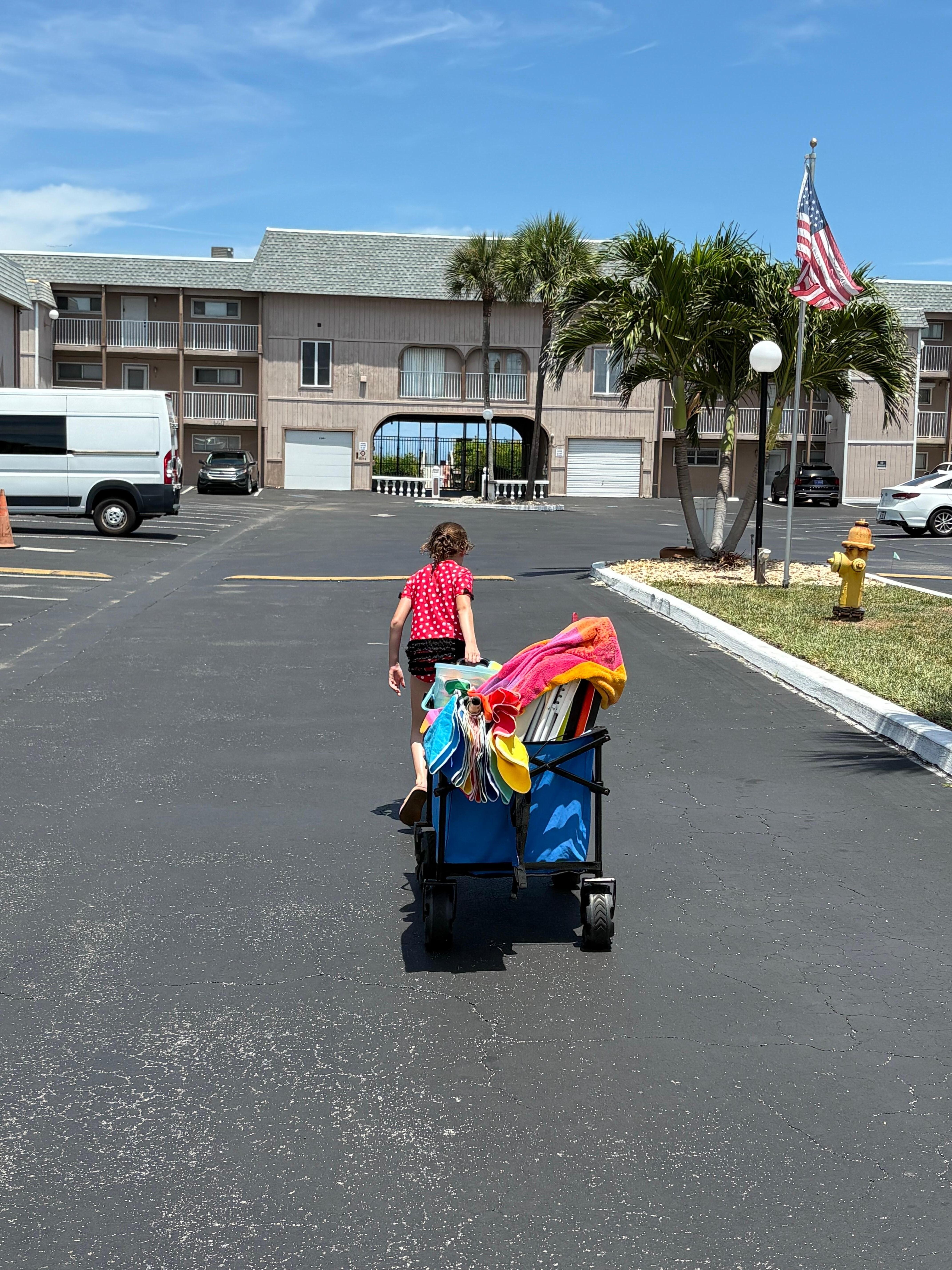 My youngest “being Dad for the day” relieving her father the duty of pulling all the provided beach gear. 