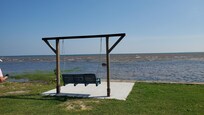Swing between the house and the shore