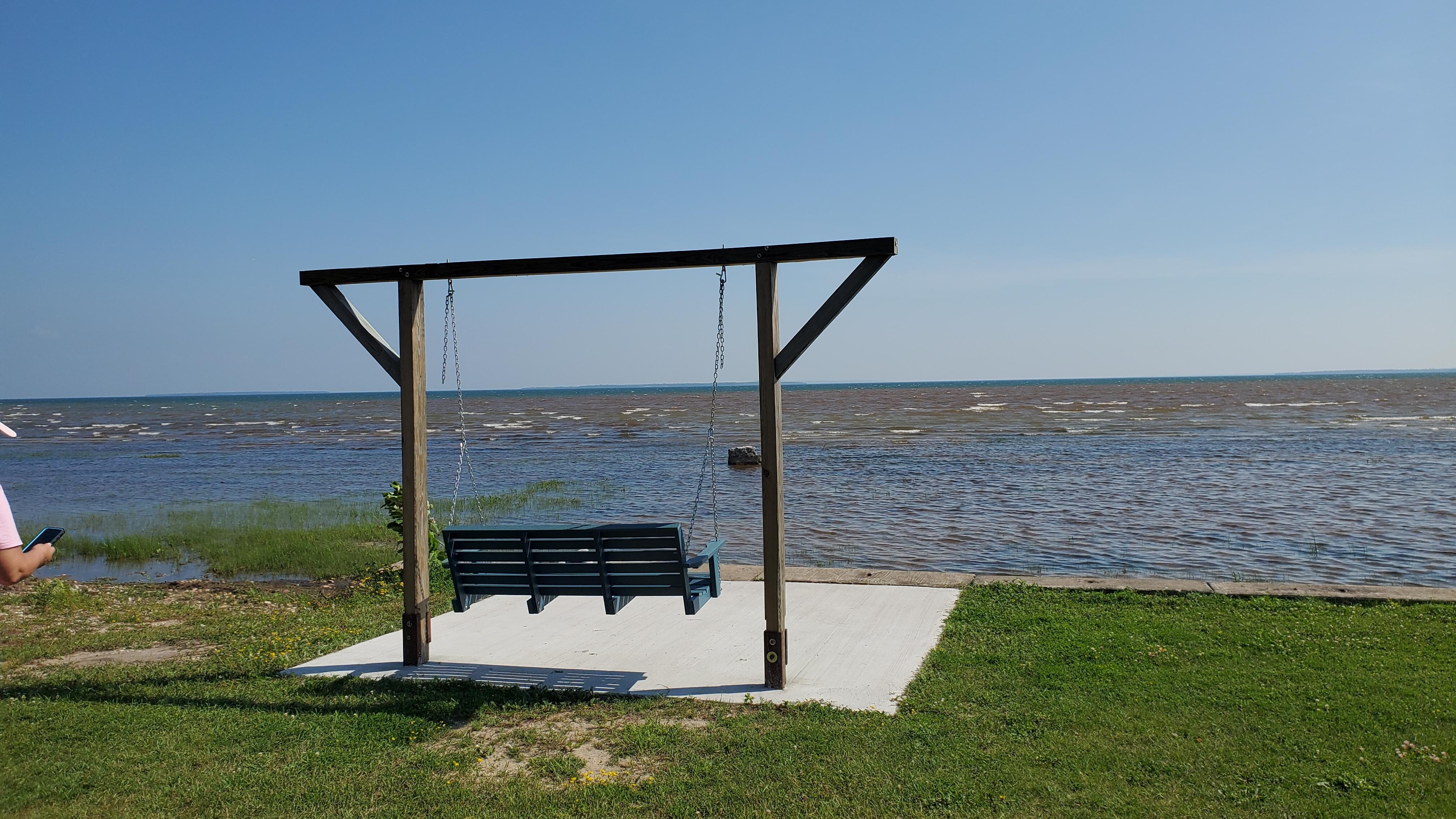 Swing between the house and the shore