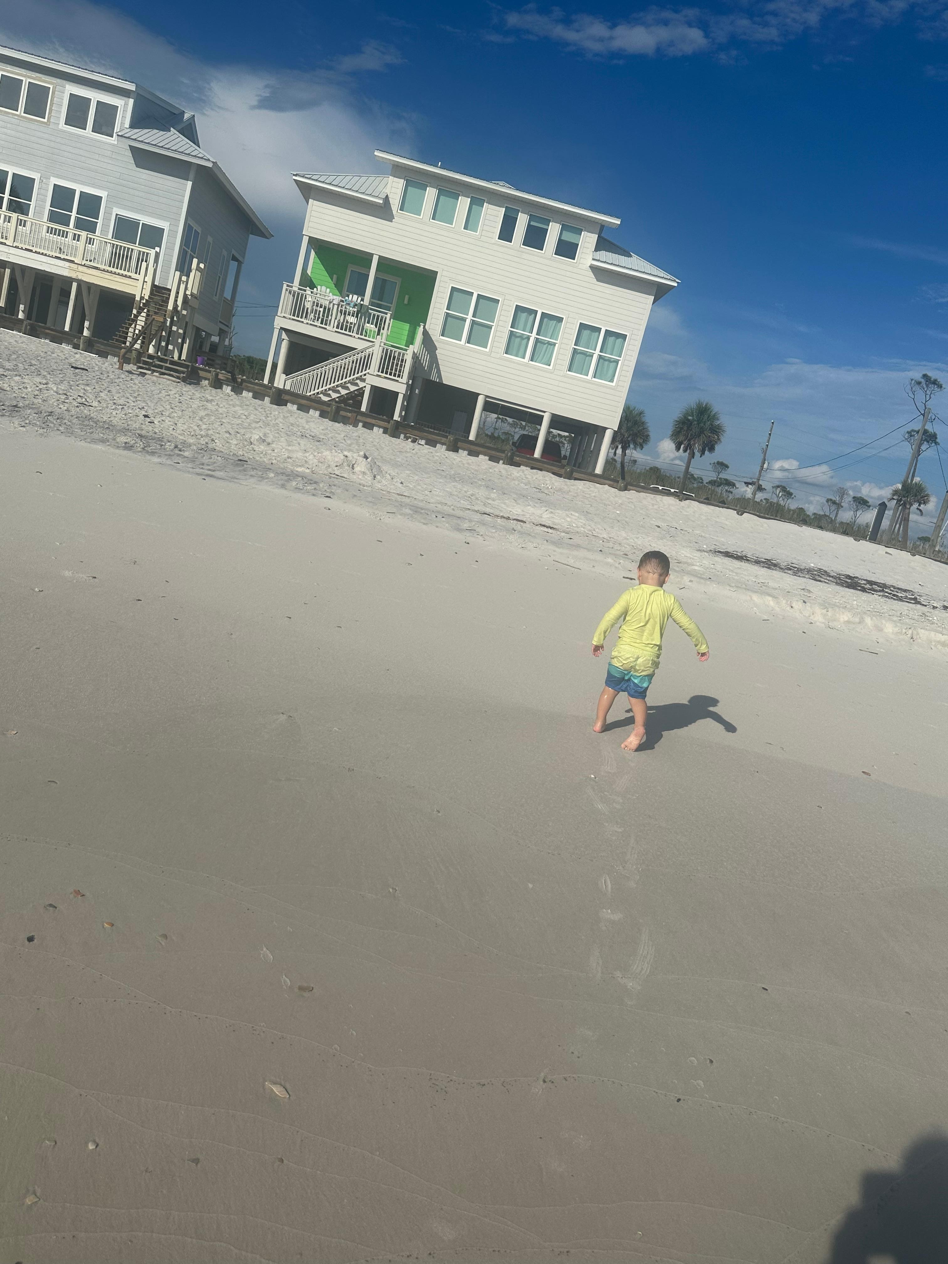 This picture was taken from edge of water with house in background