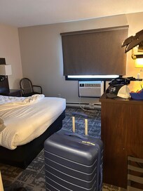 This was our room. Carpet dirty, heater falling off the wall. Mattress wouldn’t sit right on the bed