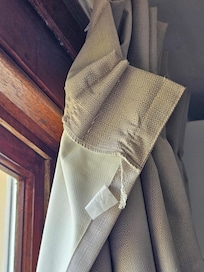 Curtains in room hanging off