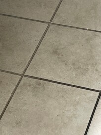 Dirty bathroom floor upon arrival