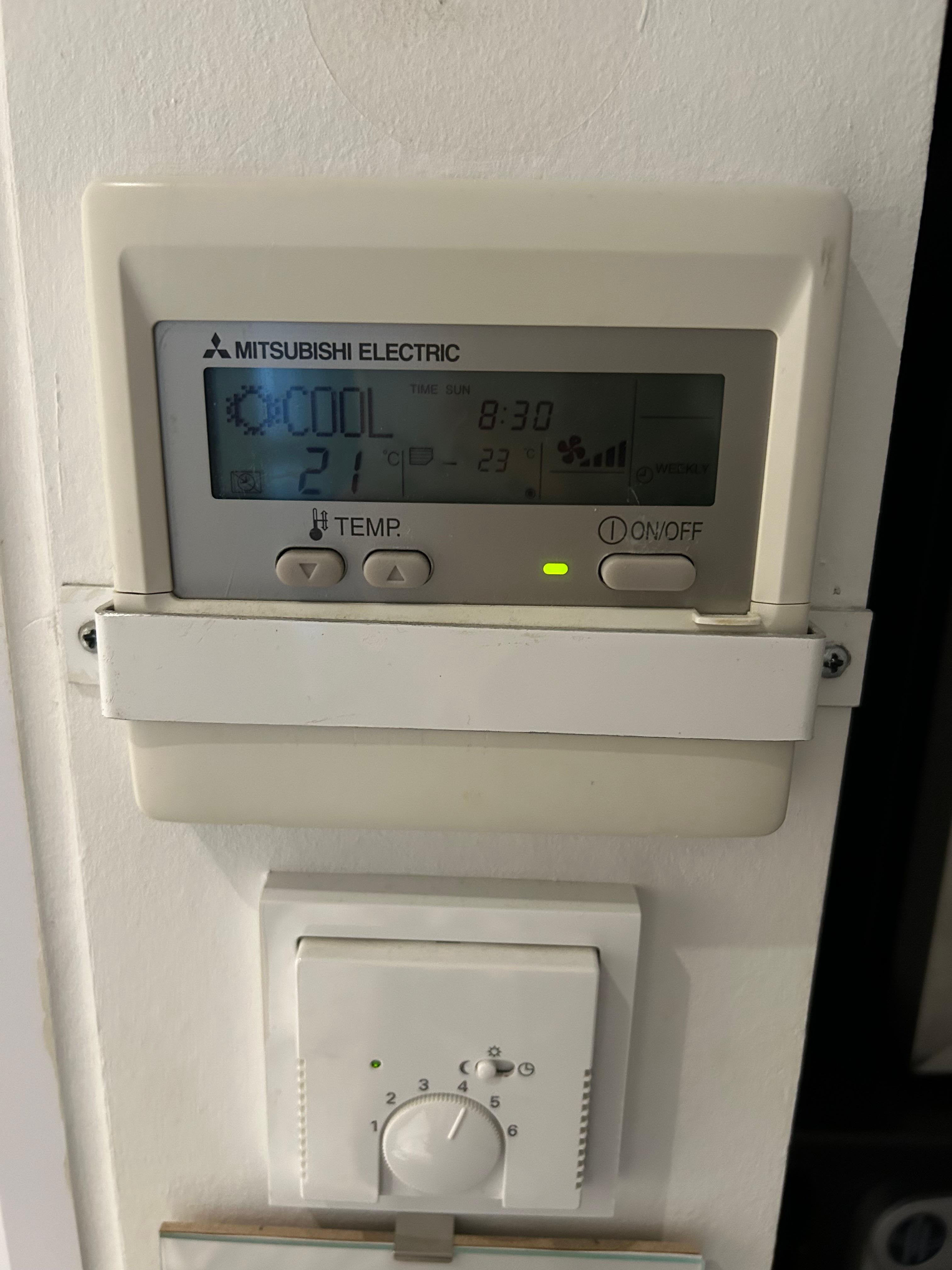 Airco remote control fixed to the wall