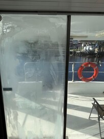 Damaged glass in aft of boat