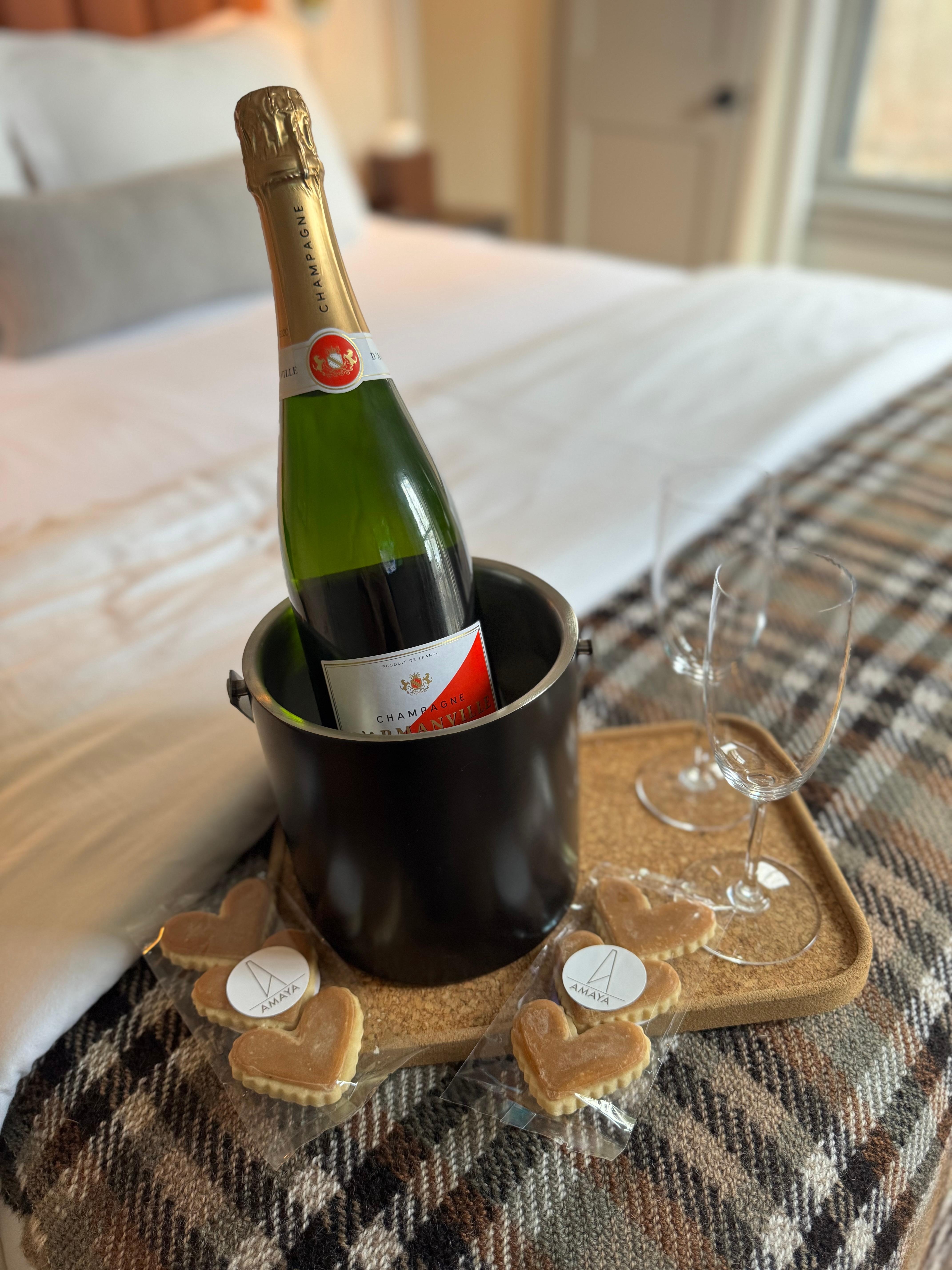 Welcomed with a celebratory bottle of wine with shortbread cookies 