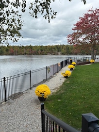 There is path to the deck with view of the lake at the rear of the property.