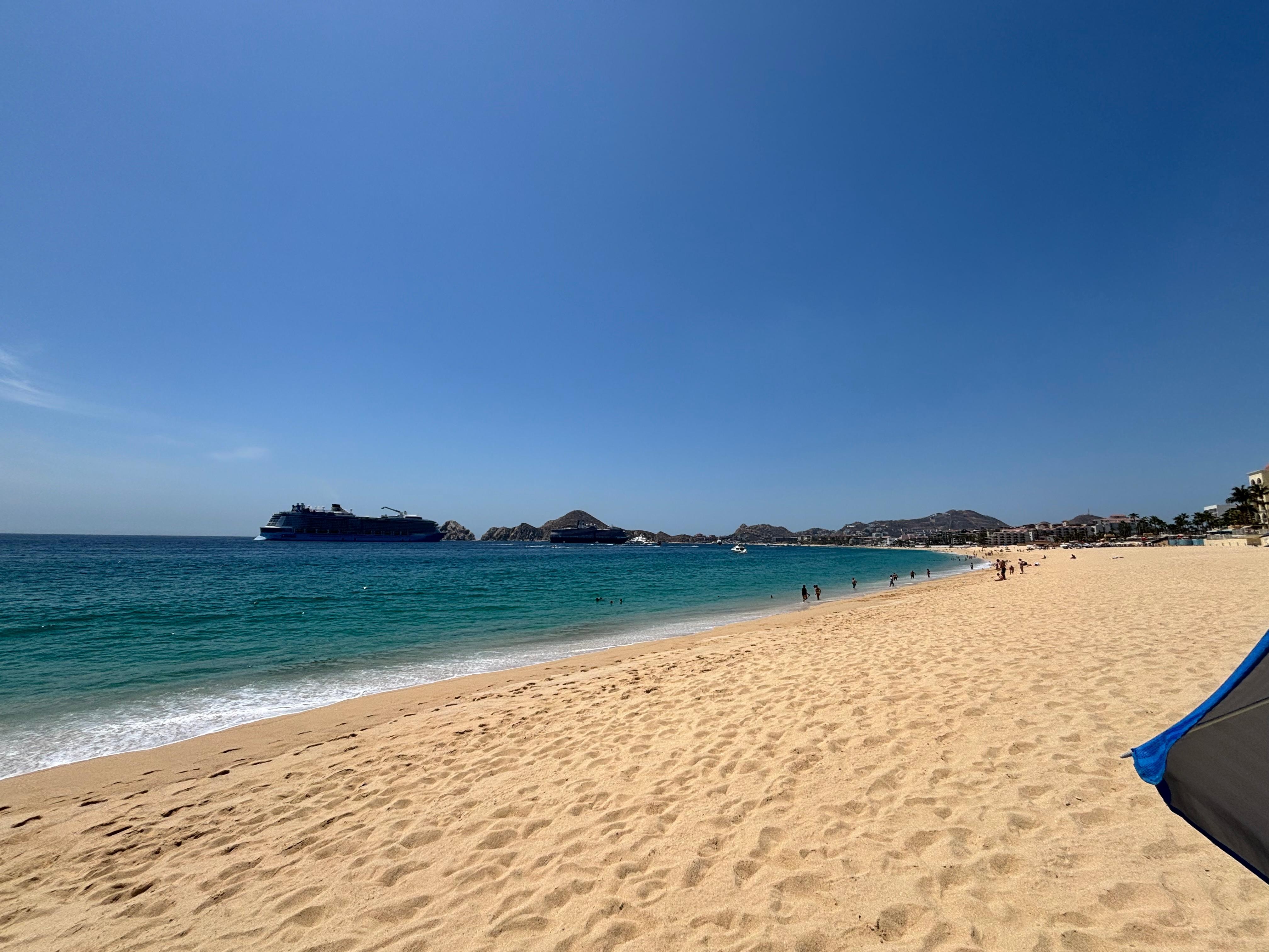 Beach at this end almost deserted; you can walk down to the craziness. 