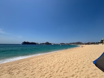 Beach at this end almost deserted; you can walk down to the craziness.