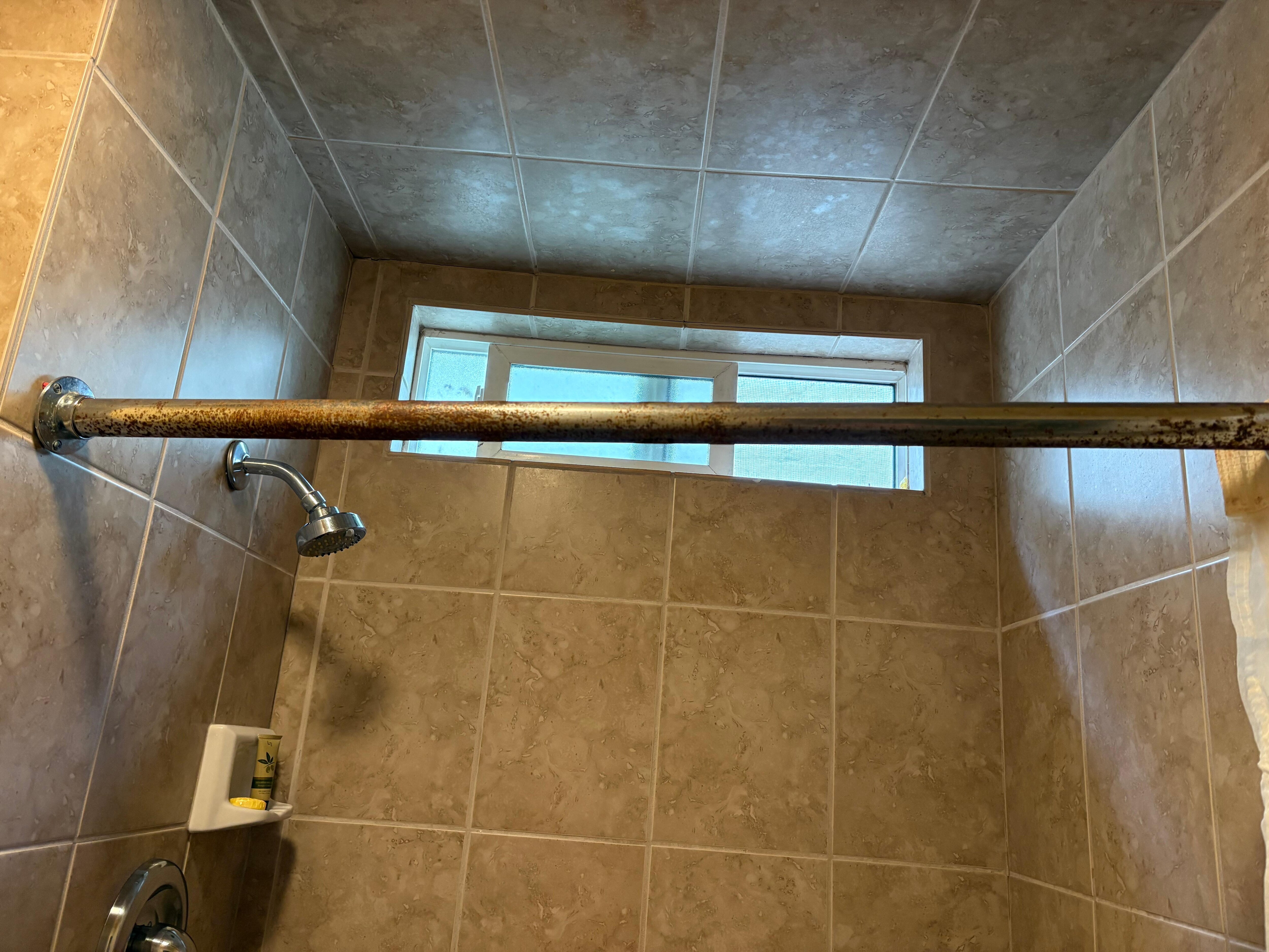 Rusted shower rod.