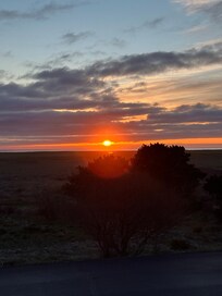 From the front porch in a cozy rocking Adirondack.