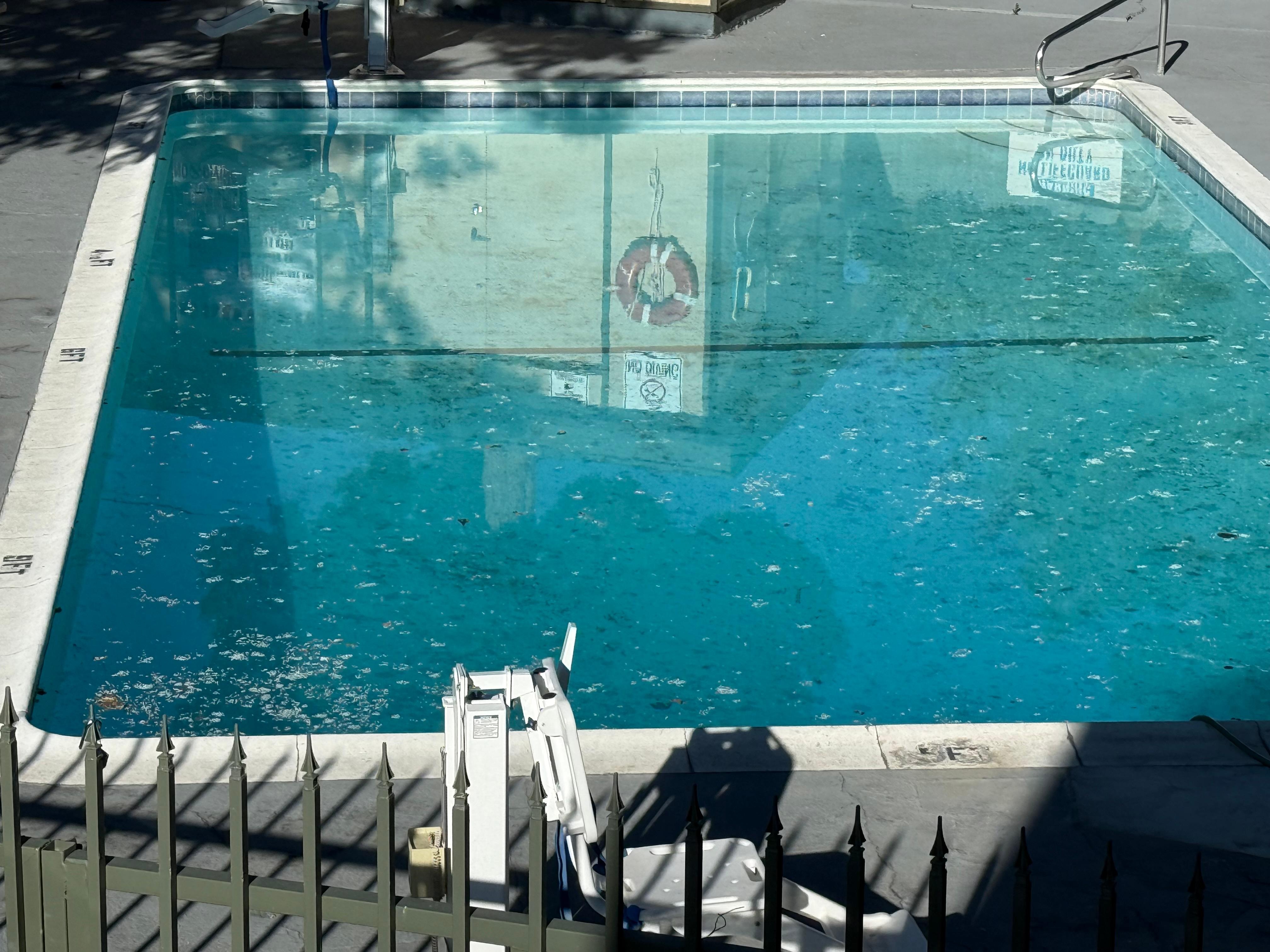 Closed, broken and gross looking pool that sure looks much nicer on the website than in person.