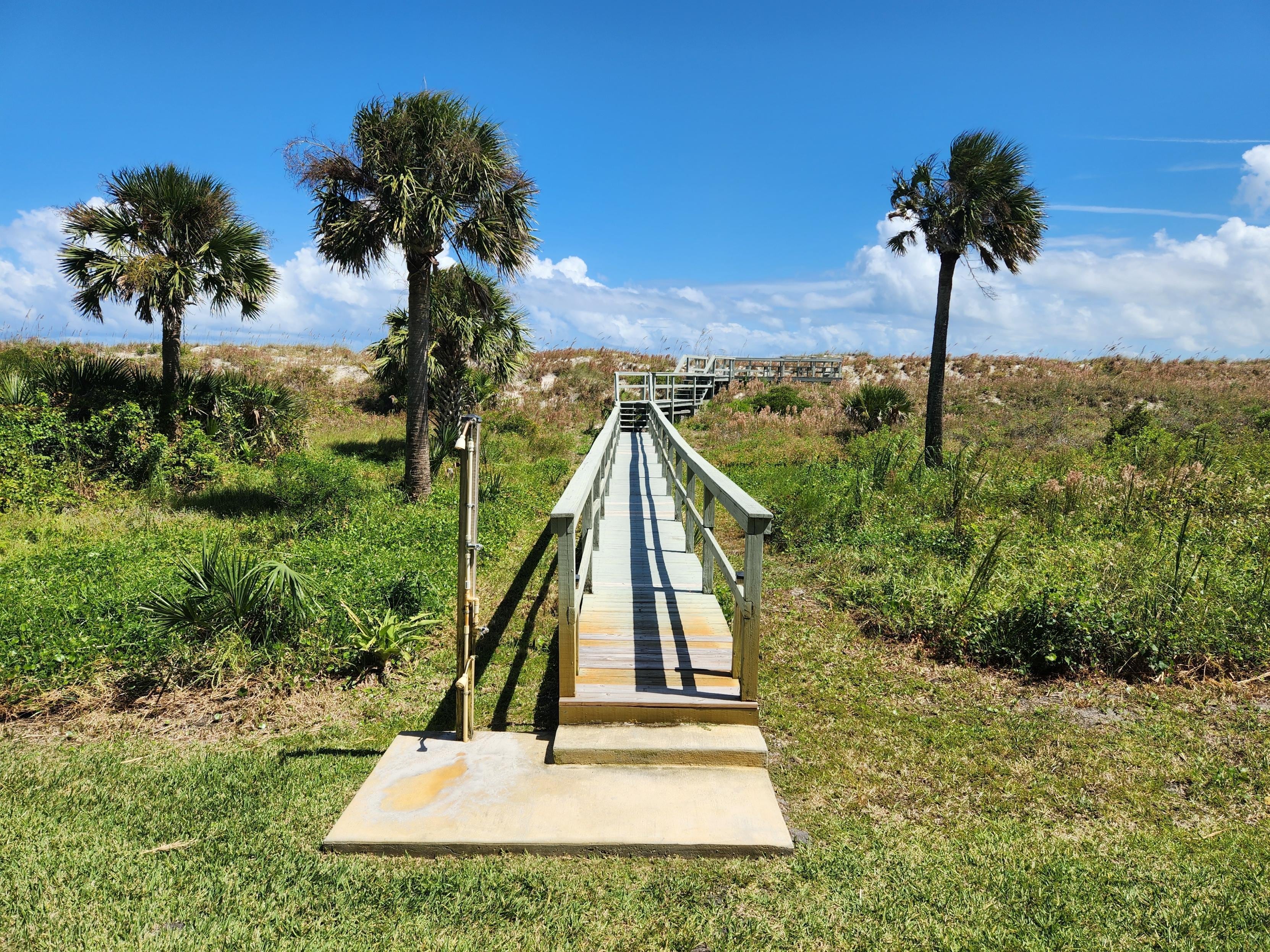 View of walkway from unit looking toward each.  Does not reach beach, and must use public access.  Not a problem!