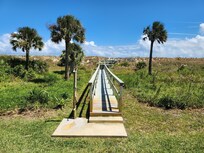 View of walkway from unit looking toward each. Does not reach beach, and must use public access. Not a problem!