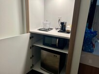 Cute area, open up cabinet and there is a microwave and refrigerator in there.