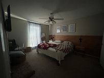 Living room and front door with dining area next to living room