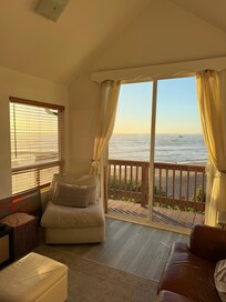 The back half of the living room that is connected to the entrance room