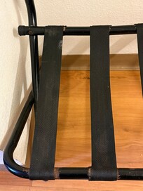 Rusted and dirty luggage rack.