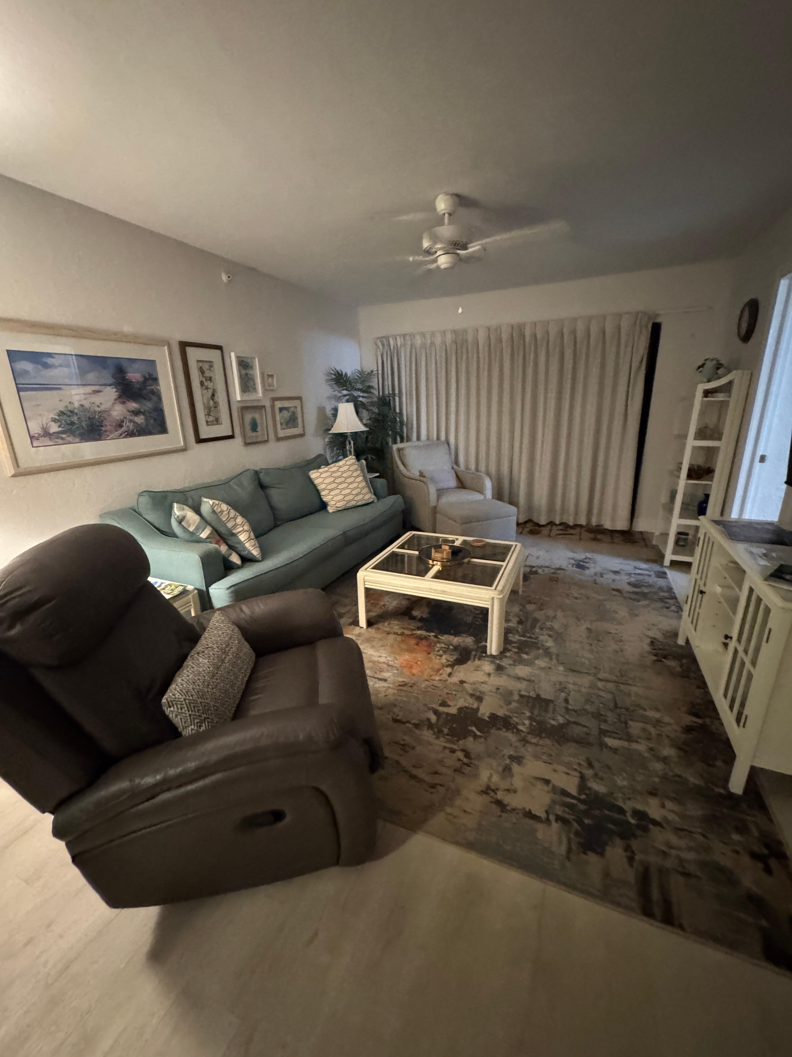 Living room with plenty of seating and a TV