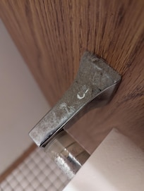 Dust buildup on toilet paper roll holder