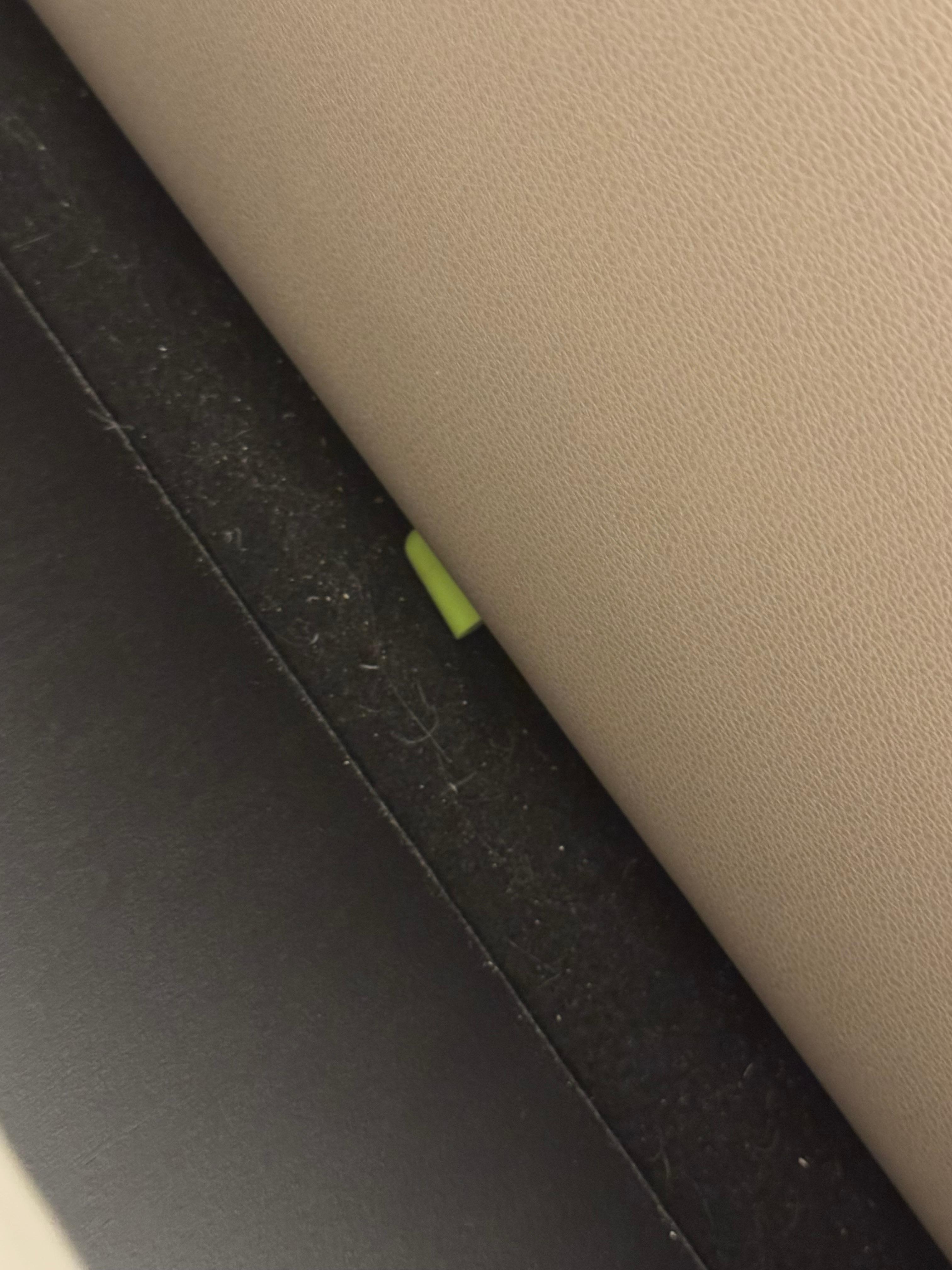 An ear plug and white substance between the headboard and mattress. Pretty gross. 