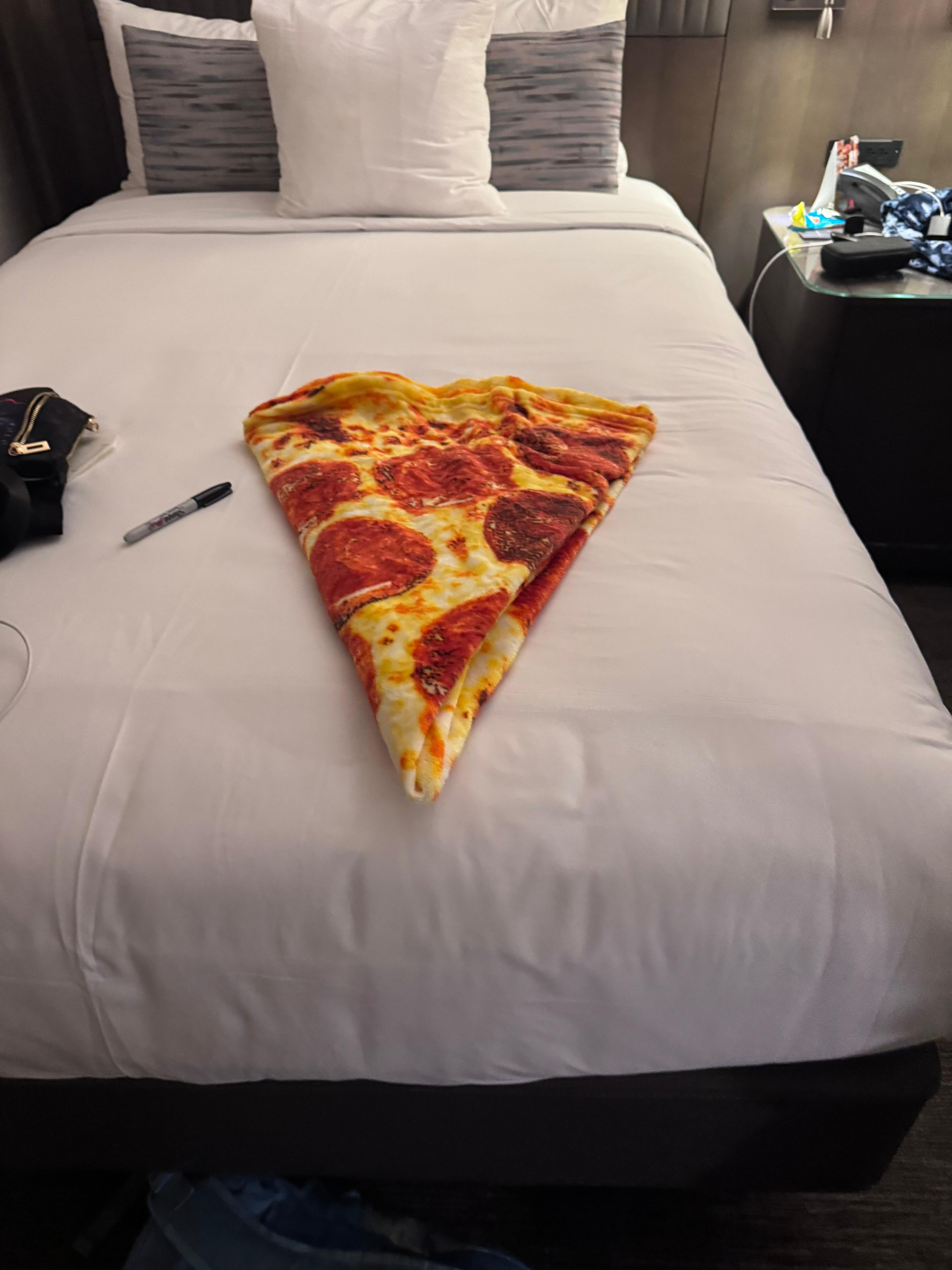 Housekeeping has a great sense of humor and folded my kids cover to look like a slice of pizza. 