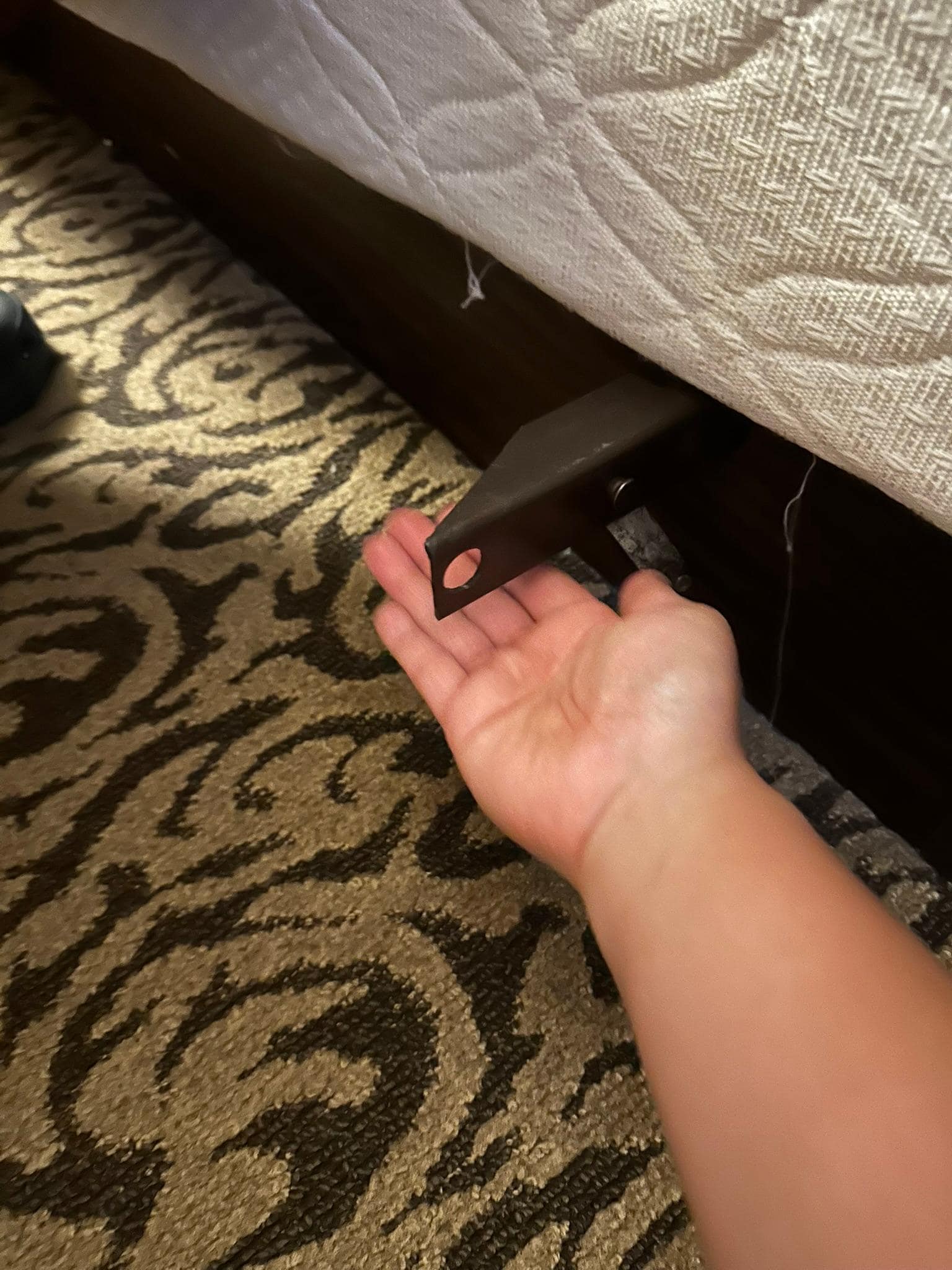 Metal from Box spring frame sticking out. Very dangerous as it's covered by the bedskirt.