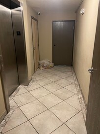Garbage left in elevator lobby for a day and a half.