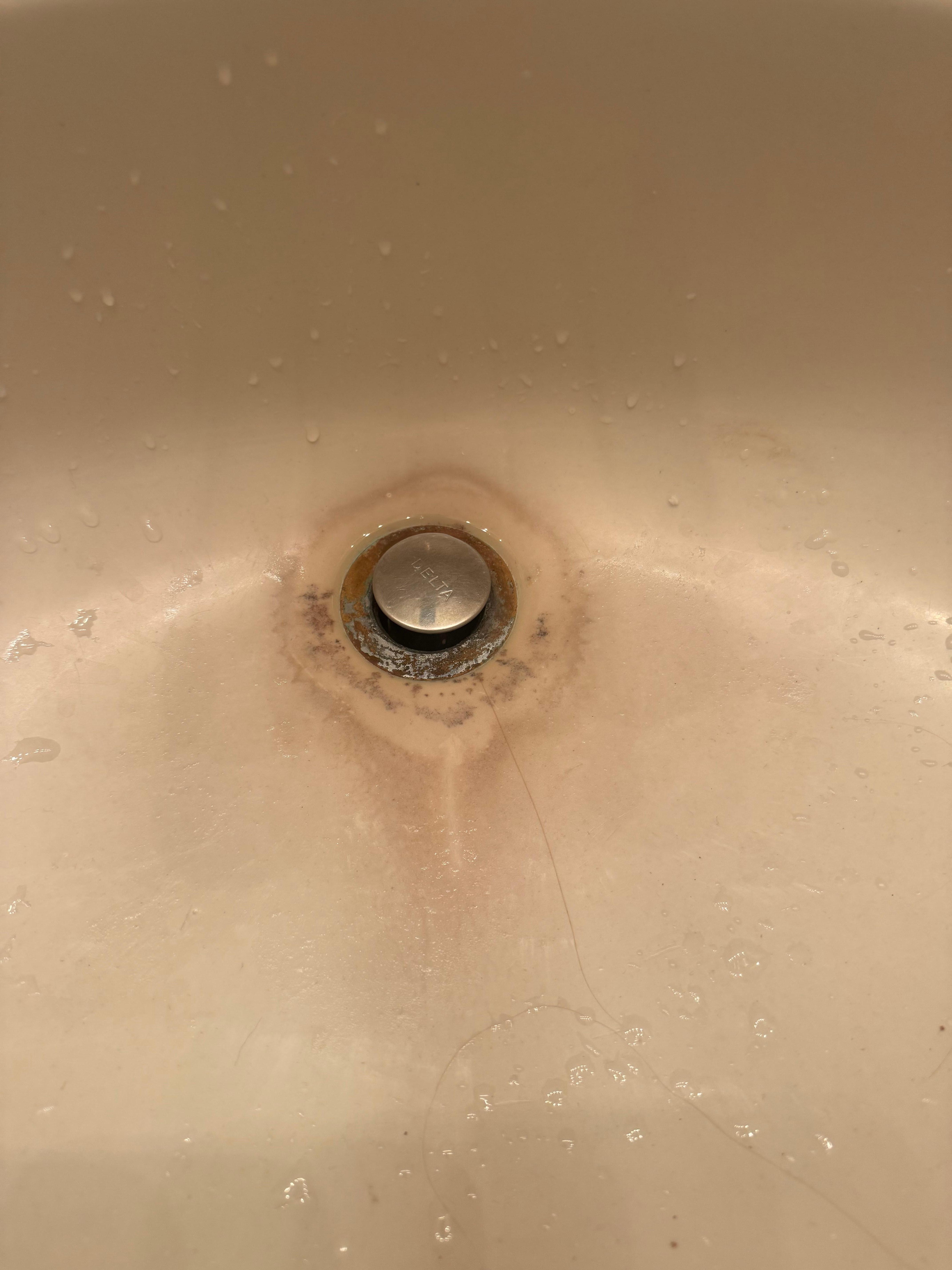Dirty sink.  Looks like mold.  
