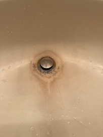 Dirty sink. Looks like mold.