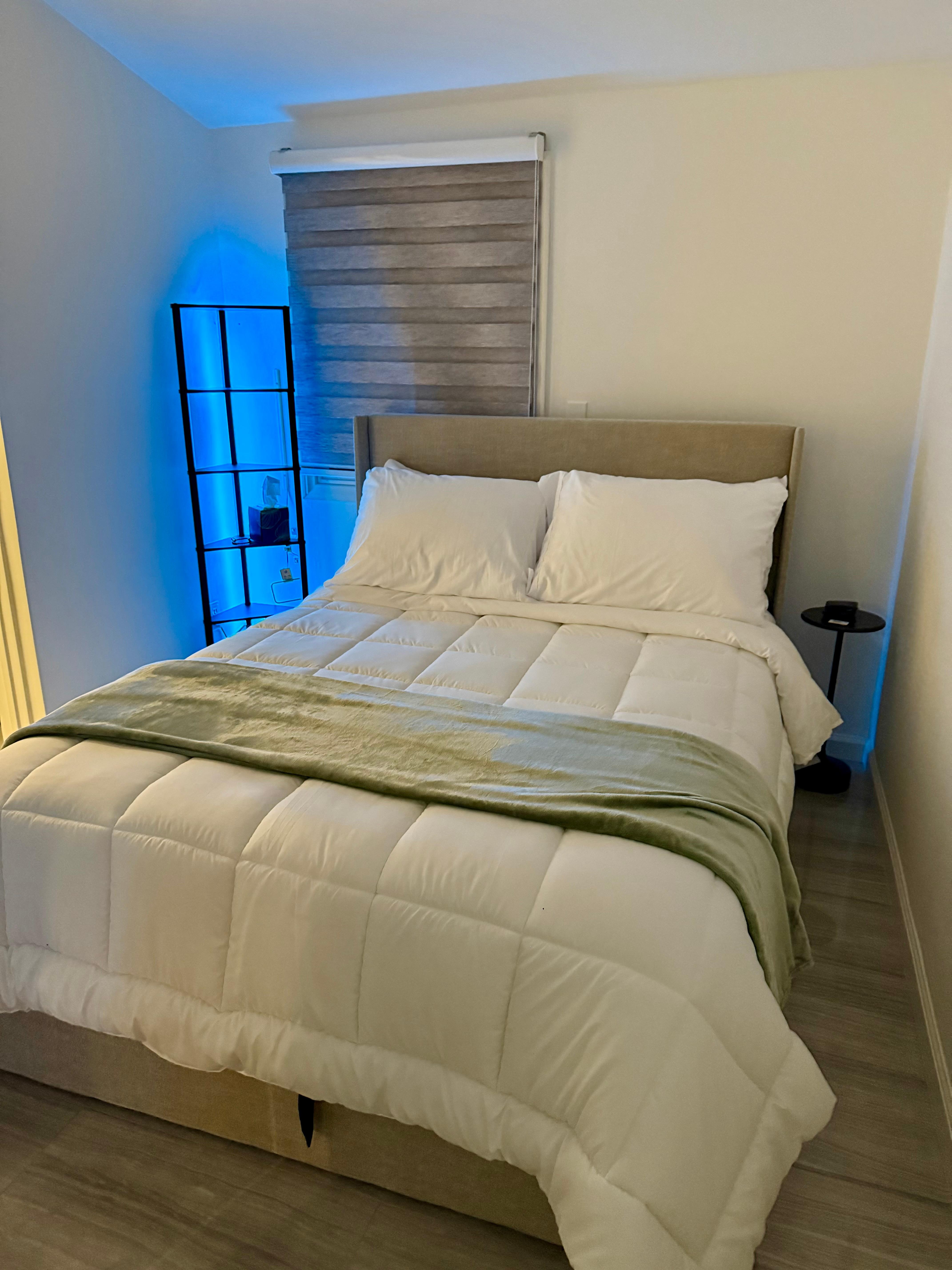 Bedroom has a double size bed with comfortable beddings