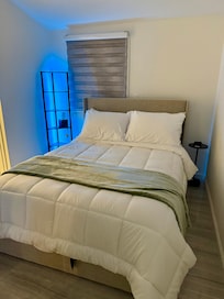 Bedroom has a double size bed with comfortable beddings