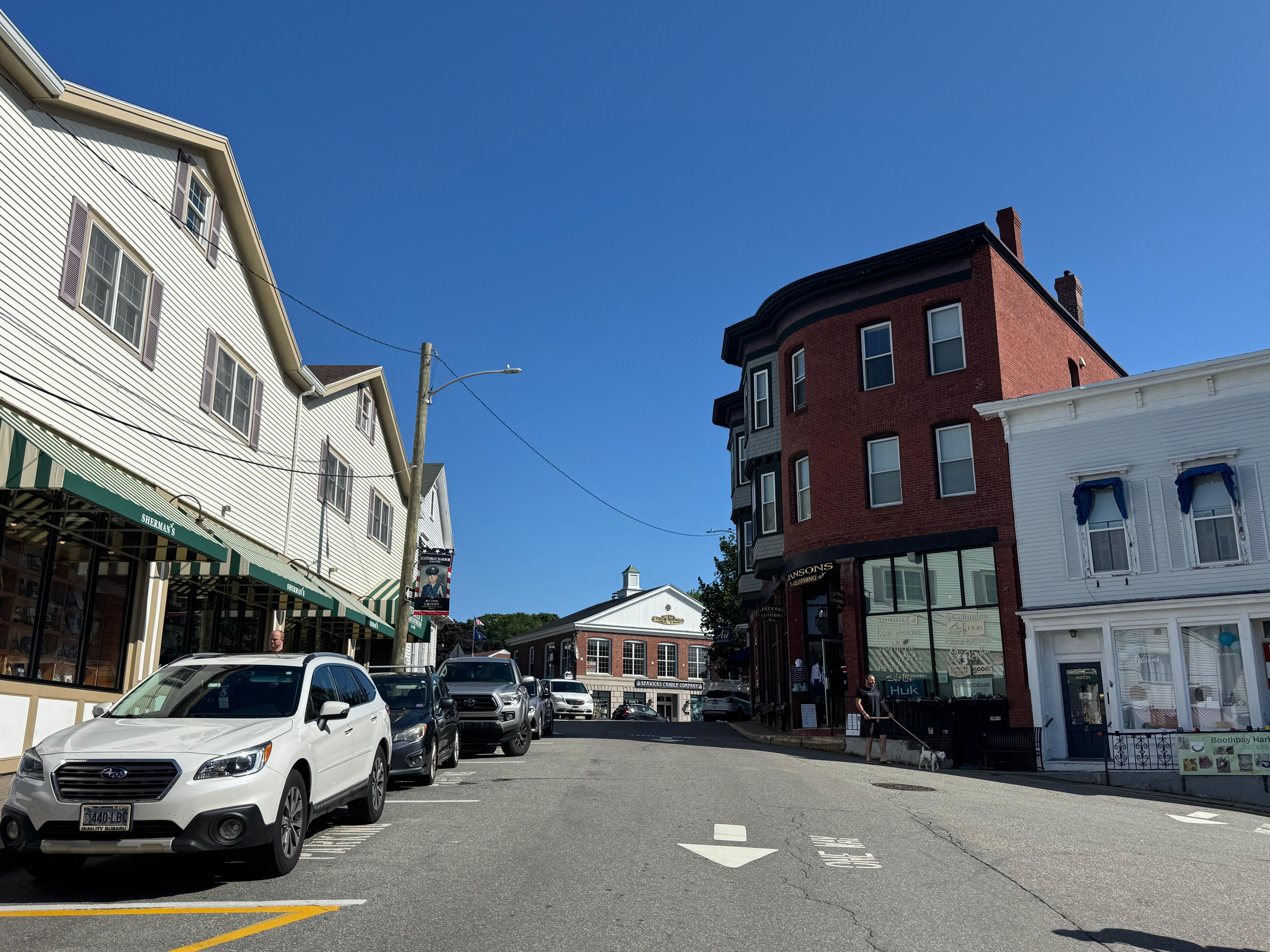 Apartment is one third floor of red brick building on right, in the middle of town.  