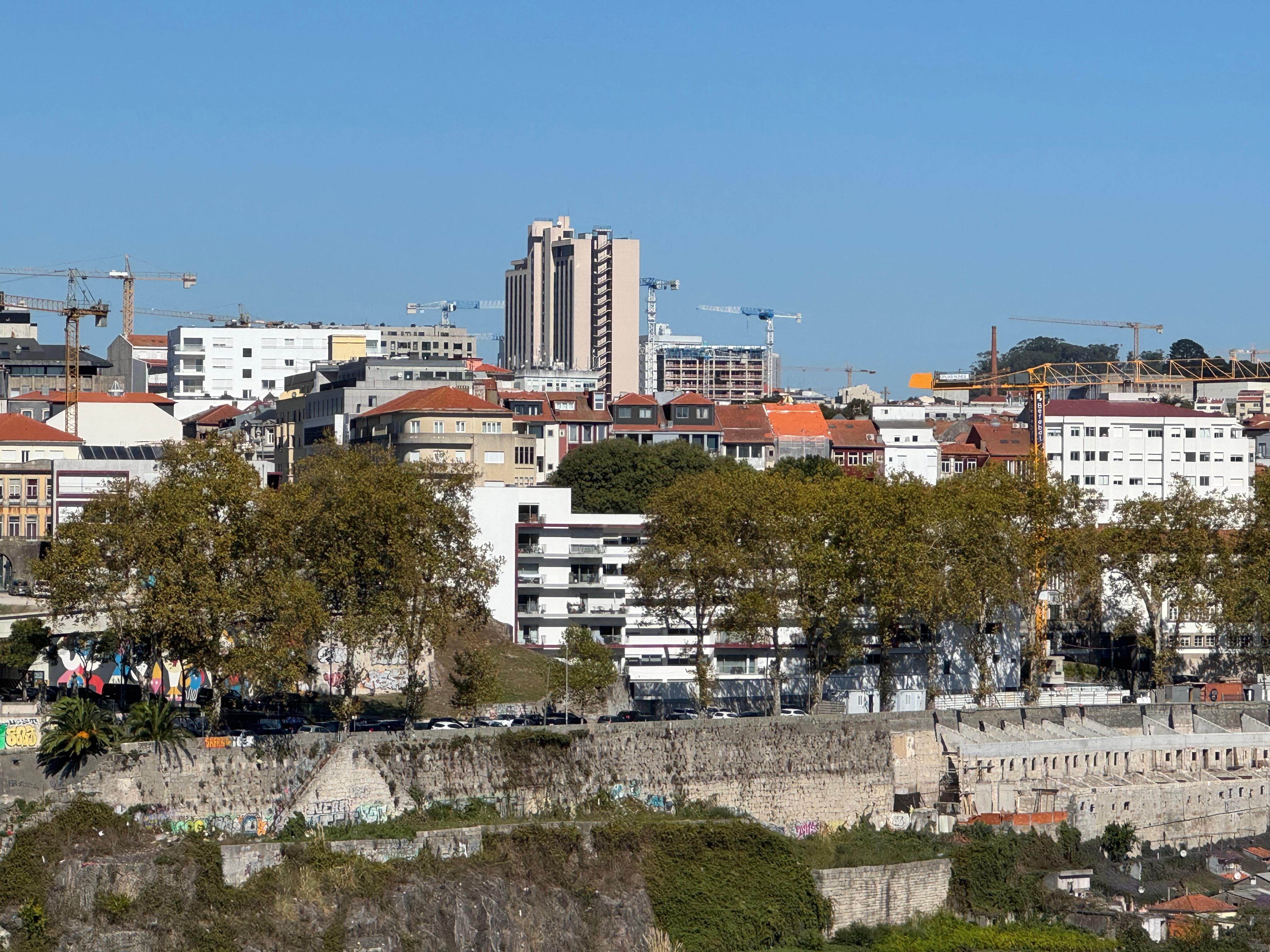 View of the apartment building (the white one) from across the river