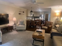 Den looking into kitchen and dining