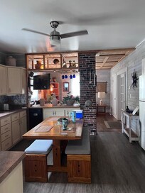 The kitchen and living room were spacious and so comfortable. It'd be really easy to cook dinner here instead of going out. The two bedrooms are to the right in this pic and were really nice as well.