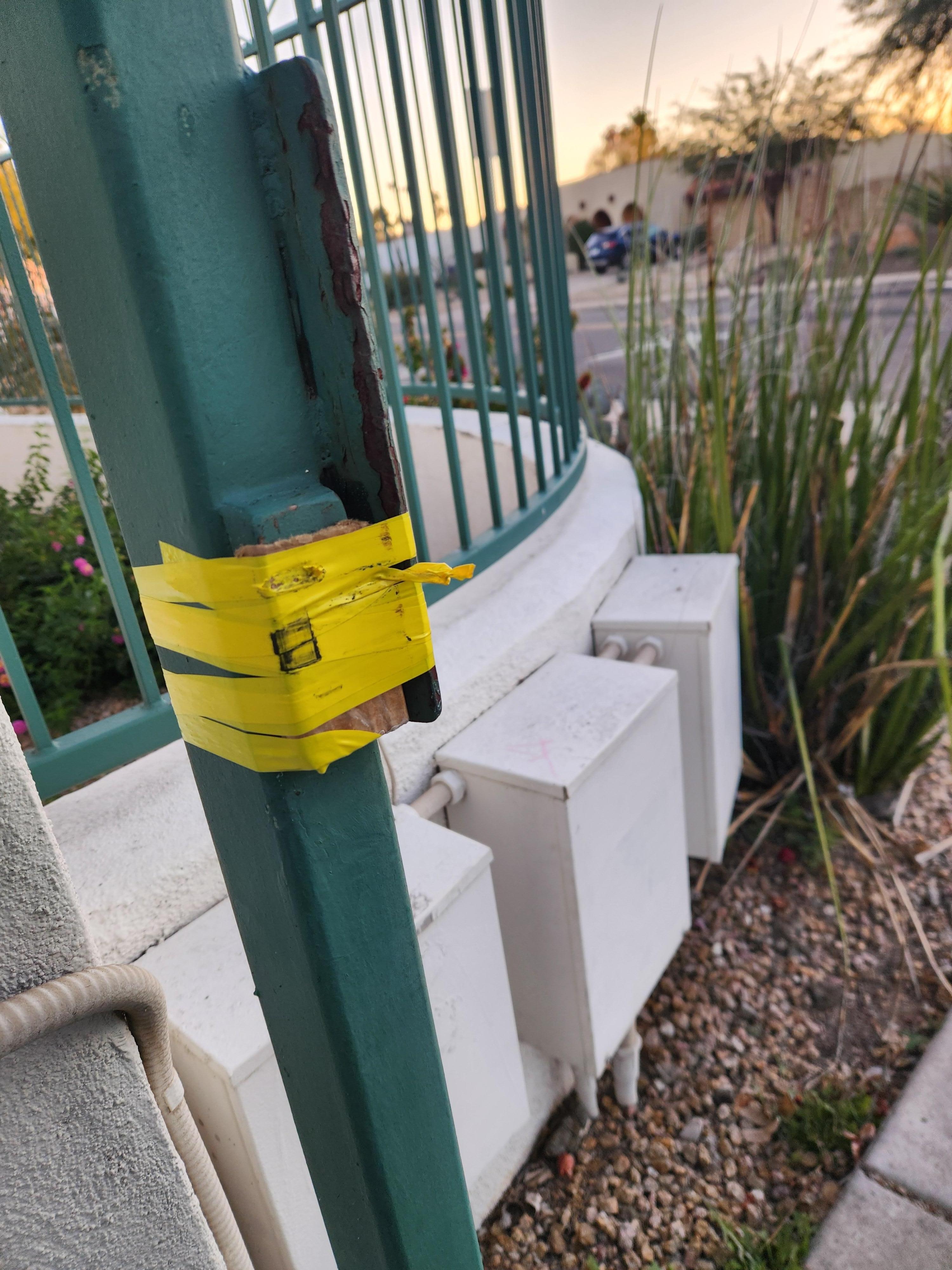 The walk-in gate that had no lock or handle. The sidewalk to this goes right in front of the home = this gate is connected to the fence/gate of the home.