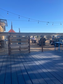 In the pool looking at the outdoor seating in front of the current stage for live entertainment.