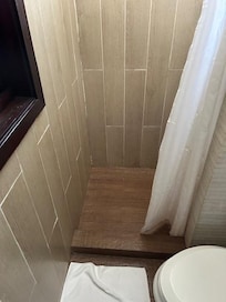 I barely squeezed in between the toilet and the wall to get to the shower